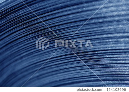 Curved lines of rolled metal are made of sheet steel. Curved lines of rolled metal are made of sheet steel. 134102696
