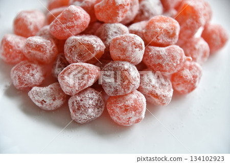 Candied kumquat in a powdered sugar Candied kumquat in a powdered sugar 134102923