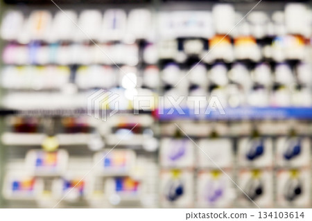 Blurred retail store aisle with merchandise on shelves Blurred retail store aisle with merchandise on shelves 134103614