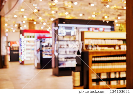Blurry cosmetics store interior creating bokeh background effect Blurry cosmetics store interior creating bokeh background effect 134103631