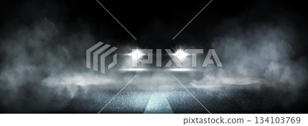 Dark wet asphalt road with car headlights 134103769