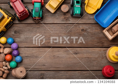Top view of kids toys frame on wooden background with copy space. Top view of kids toys frame on wooden background with copy space. 134104088