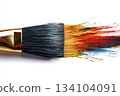 Paintbrush dripping colorful paint onto white paper creating art 134104091