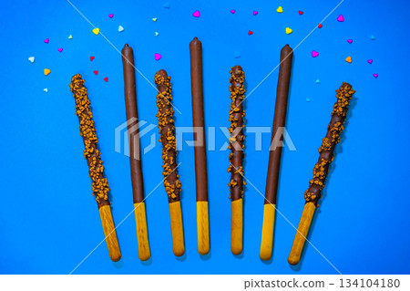 Dropped in chocolate a stick cookie Pepero. November 11th is Pepero Day in Korea Dropped in chocolate a stick cookie Pepero. November 11th is Pepero Day in Korea 134104180