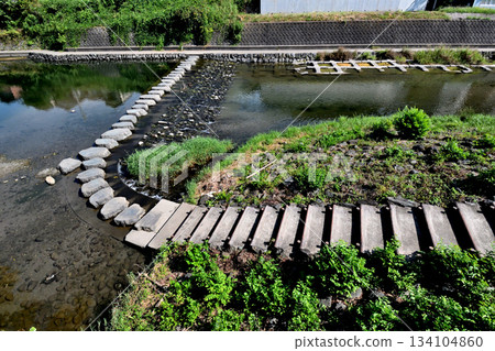 Stepping stones downstream of Tochimoto Weir on the waterfront promenade Stepping stones downstream of Tochimoto Weir on the waterfront promenade 134104860