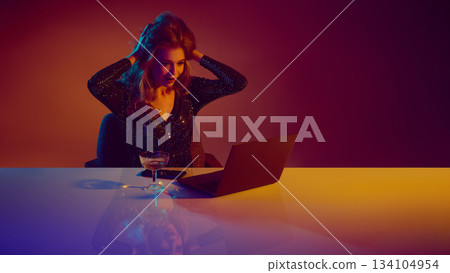 Woman expressing shock and disbelief during online casino play. Woman expressing shock and disbelief during online casino play. 134104954