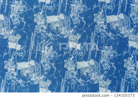 Blue fabric texture with lurex and an abstract pattern. Blue fabric texture with lurex and an abstract pattern. 134105373