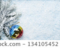 Colorful Mirror Christmas Bauble on Snow 134105452