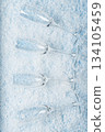 Champagne Glasses on Snowy Winter Background 134105459