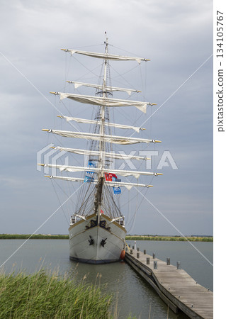 Sailing ship docked at Marker Wadden harbour in the Netherlands during cloudy weather 134105767