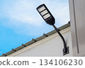 Solar light on concrete wall for to provide illumination around the road and walkway in the house with views of beautiful blue sky in the morning. 134106230