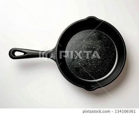 Kitchen still life. Cast iron pan. Kitchenware on white background. Top view. Kitchen still life. Cast iron pan. Kitchenware on white background. Top view. 134106361