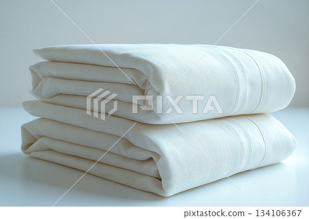 Attract luxury buyers. Cotton sheets on a white background. Stack of comfortable white sheets. 134106367