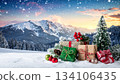 Winter scene 2 with presents and decorations shining on the snow 134106435