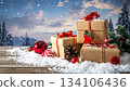 Winter scene 3 with presents and decorations shining on the snow 134106436