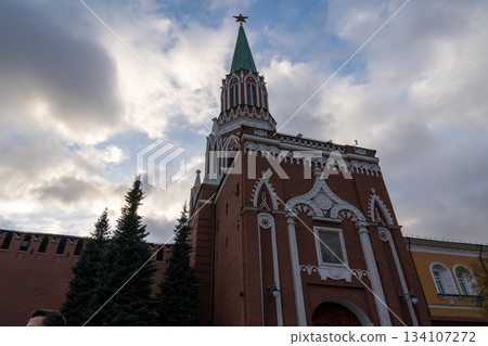 Historic Red Brick Church Tower With Green Spire And Star Over Old Kremlin Wall Historic Red Brick Church Tower With Green Spire And Star Over Old Kremlin Wall 134107272