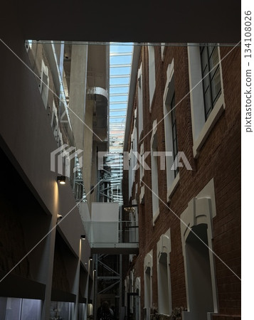 Industrial modern atmosphere, Contemporary design featuring brick and glass details Industrial modern atmosphere, Contemporary design featuring brick and glass details 134108026