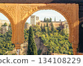 View of Alhambra palace through ornate archway, Granada Spain 134108229