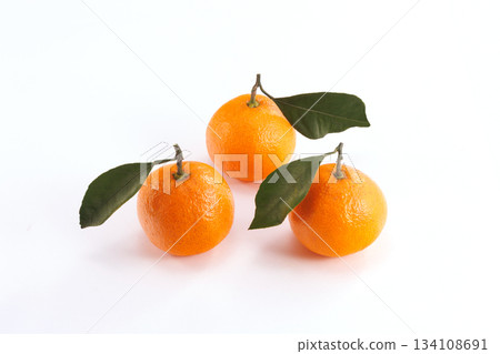 Fresh tangerines with leaves Fresh tangerines with leaves 134108691