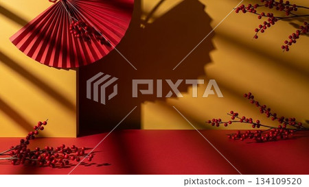 A Japanese-style design featuring a red fan and nandina berries on a yellow and red background with stripes of light and shadow. A Japanese-style design featuring a red fan and nandina berries on a yellow and red background with stripes of light and shadow. 134109520