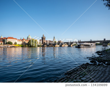 The Charles Bridge crossing the Vltava River in Prague, Czech Republic.  134109899