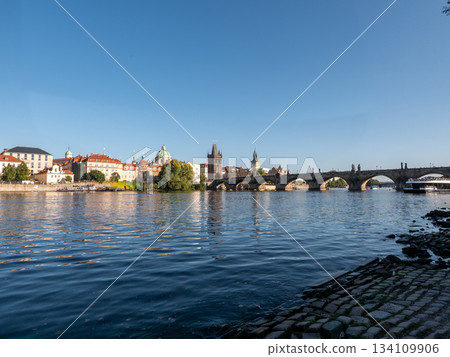 The Charles Bridge crossing the Vltava River in Prague, Czech Republic.  134109906