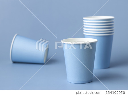 Disposable light blue paper cups closeup, mockup, copy space. No plastic biodegradable single-use Disposable light blue paper cups closeup, mockup, copy space. No plastic biodegradable single-use 134109950
