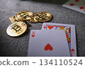Bitcoin cryptocurrency coins and playing cards on table 134110524