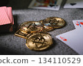 Bitcoin cryptocurrency coins with playing cards on casino table 134110529