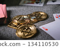 Bitcoin cryptocurrency coins with playing cards on casino table 134110530