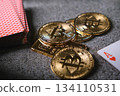 Bitcoin cryptocurrency coins with playing cards showing risk 134110531