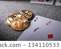 Bitcoin cryptocurrency coins with two playing cards 134110533