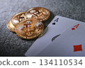Bitcoin cryptocurrency coins with playing cards on casino table 134110534