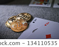 Bitcoin cryptocurrency coins with two playing cards 134110535