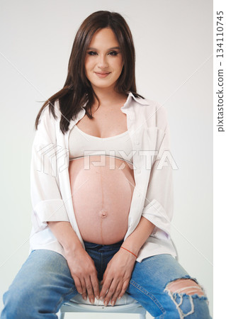 Expecting mother poses in casual style for maternity shoot Expecting mother poses in casual style for maternity shoot 134110745