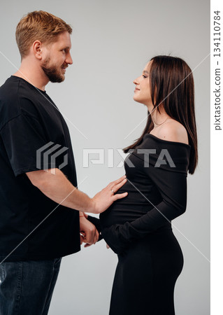 Expecting couple sharing a tender moment together Expecting couple sharing a tender moment together 134110784