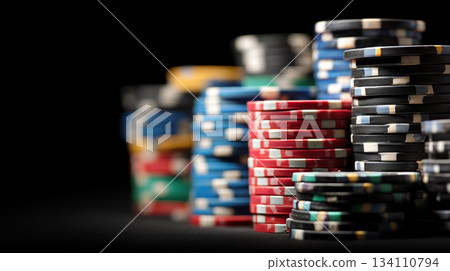 Stacks of colorful poker chips on dark background 134110794