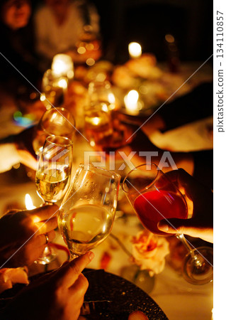 Cheers and celebration at a festive gathering with drinks Cheers and celebration at a festive gathering with drinks 134110857