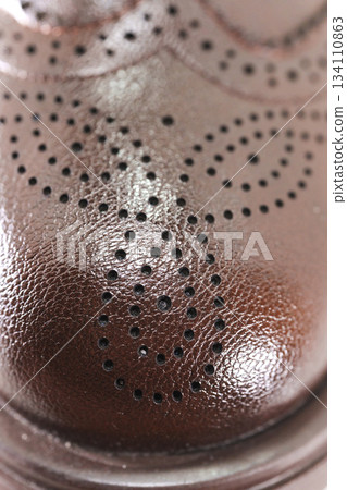 Detailed view of brown leather dress shoe design 134110863