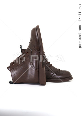 Stylish brown boots designed for comfort and versatility 134110894