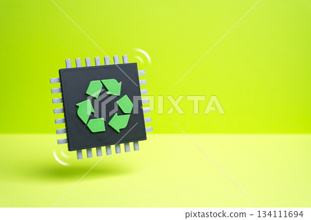 A computer microchip with a recycling symbol. The problem of electronics recycling. E-waste growth and tech sustainability challenges. Environmental reports and circular economy. A computer microchip with a recycling symbol. The problem of electronics recycling. E-waste growth and tech sustainability challenges. Environmental reports and circular economy. 134111694