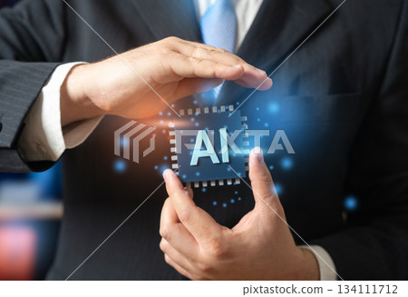 A businessman holds a computer chip with AI. New AI and neural network technologies. Implementing innovations in business and industry. Digital transformation and automation. Tech industry A businessman holds a computer chip with AI. New AI and neural network technologies. Implementing innovations in business and industry. Digital transformation and automation. Tech industry 134111712
