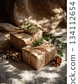 Close-up of eco-friendly parcels decorated with natural sprigs and twine. Slow-living aesthetics and gentle warmth. 134112654
