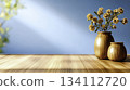 Elegant Wooden Vases with Dried Flowers on a Bright Wooden Table Surface 134112720
