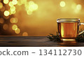 Warm Herbal Tea in Transparent Cup with Bokeh Background Sparkling Light 134112730