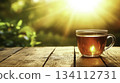 Warm Tea Cup on Wooden Table with Sunlight and Natural Background View 134112731