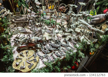 Handmade metal products from a blacksmith are on display at the New Year fair on Red Square near GUM. Horseshoes 134112763