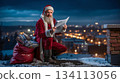 A man dressed as Santa Claus sitting on top of a building reading a newspaper 134113056
