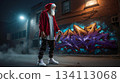 A man in a santa claus outfit standing in front of a graffiti covered wall 134113068