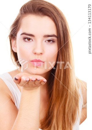 Teenager woman sending air kisses, love gesture Teenager woman sending air kisses, love gesture 134113170